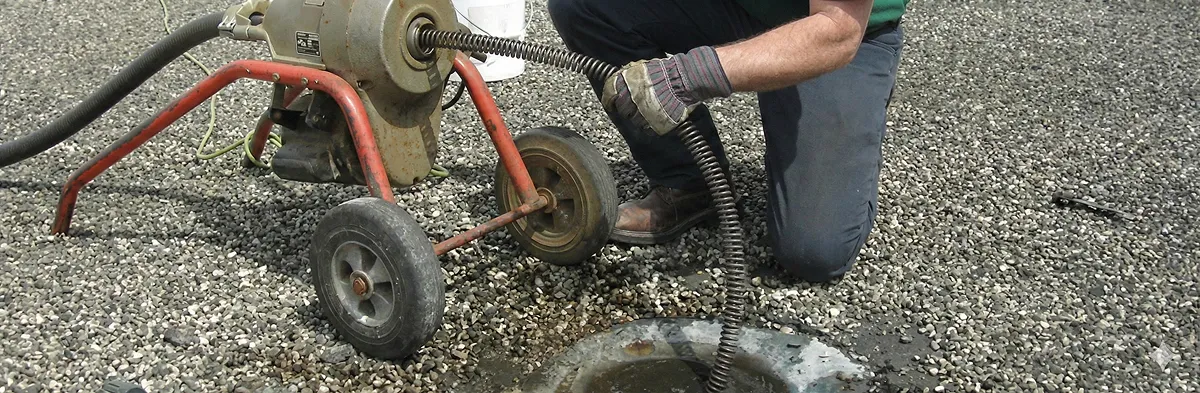 sewer rodding technician actively removing blockages from a sewer line in Nashville, TN