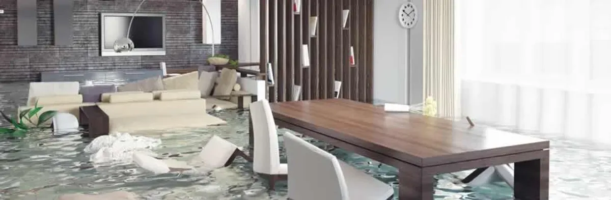 home interior affected by water damage with flooded floors and displaced furniture in Nashville, TN